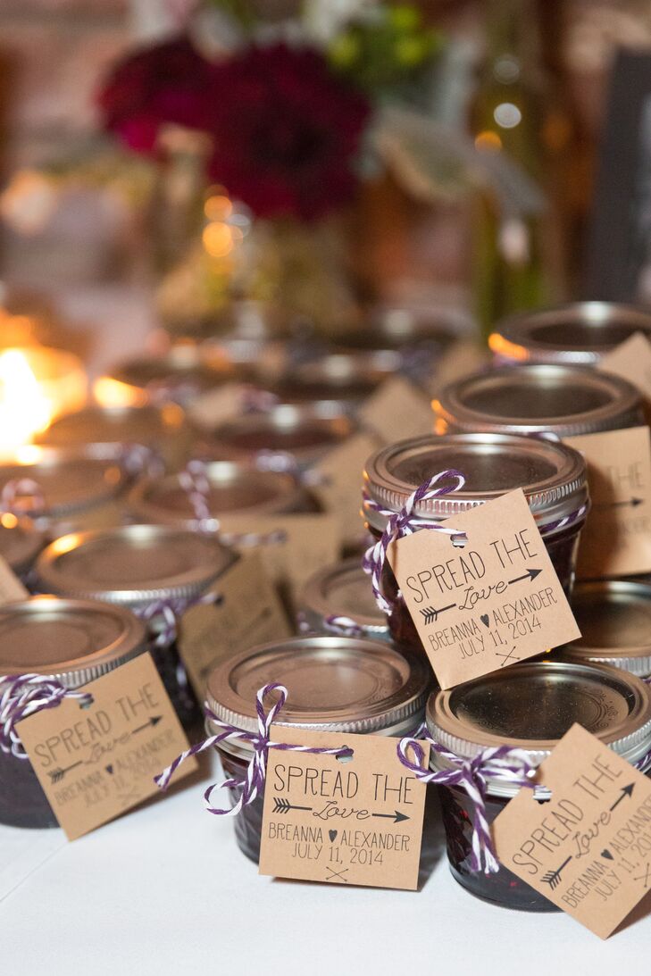 Homemade triple berry jam was given to guests to take home. These were made by Breanna’s stepmother and grandmother, who packaged the jams in small glass jars with kraft paper tags that read “Spread the Love.”