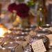 Homemade triple berry jam was given to guests to take home. These were made by Breanna’s stepmother and grandmother, who packaged the jams in small glass jars with kraft paper tags that read “Spread the Love.”