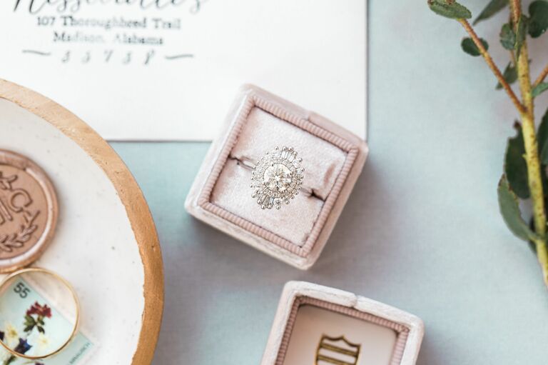 Sunburst halo engagement ring in pink velvet box