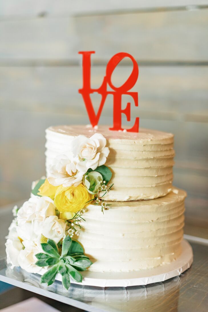 Two-Tiered Wedding Cake with Comb Frosting, Flowers and Red Cake Topper
