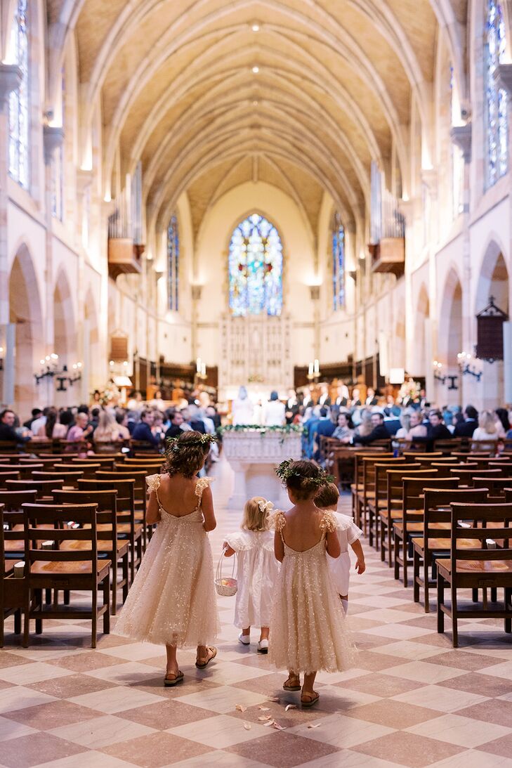 Flower Girls in Sparkly Dresses and Flower Crowns Walk Down Church Aisle