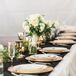 Instead of numerous floral centerpieces, Kassi opted for simple green garlands wrapped with fairy lights.