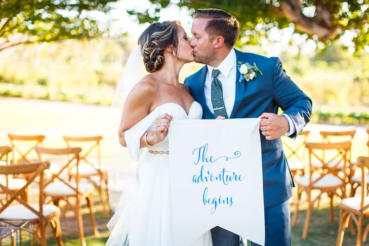 “Traveling is something I love to do, and it was a big part of our relationship, so it all just seemed perfect,” Taylor says of their nuptials at Flora Farm in San Jose del Cabo, Mexico. The newlyweds embraced their wanderlust by holding a sign that read “The Adventure Begins.”