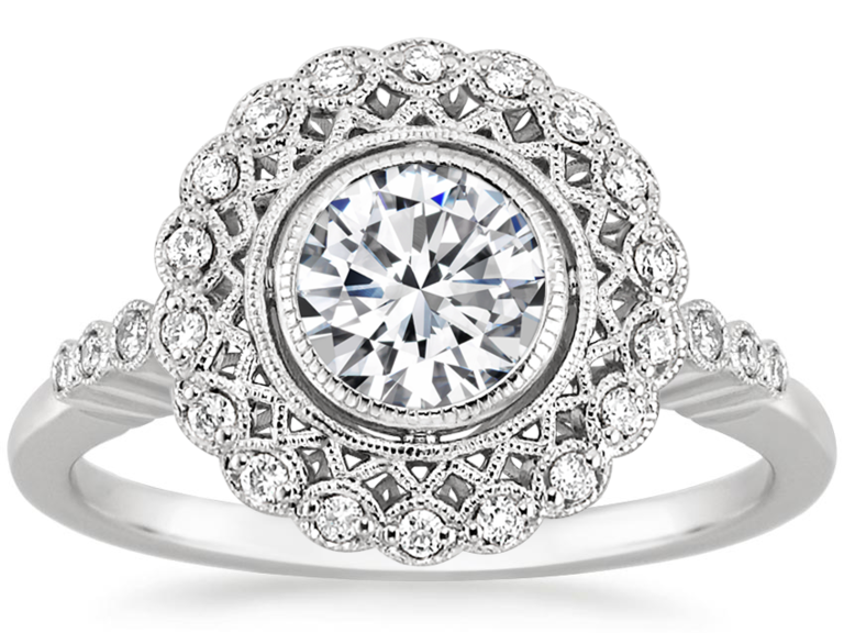 Oval center diamond with silver lattice setting and round diamonds