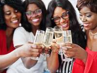 Women toasting champagne.