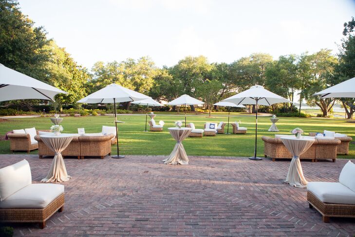 Wicker lounge furniture with plush white cushions dotted the plantation's grand lawn, setting a relaxed tone for the cocktail hour.
