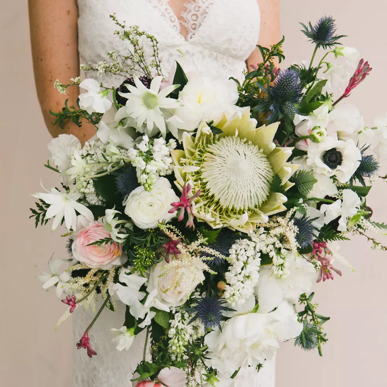 Gorgeous overflowing protea wedding bouquet