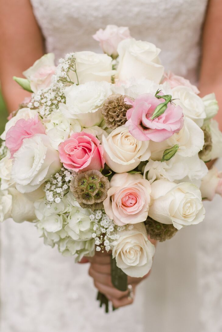 Ashley held an ivory or pink bouquet or roses, hydrangeas and succulents accented with baby's breath.