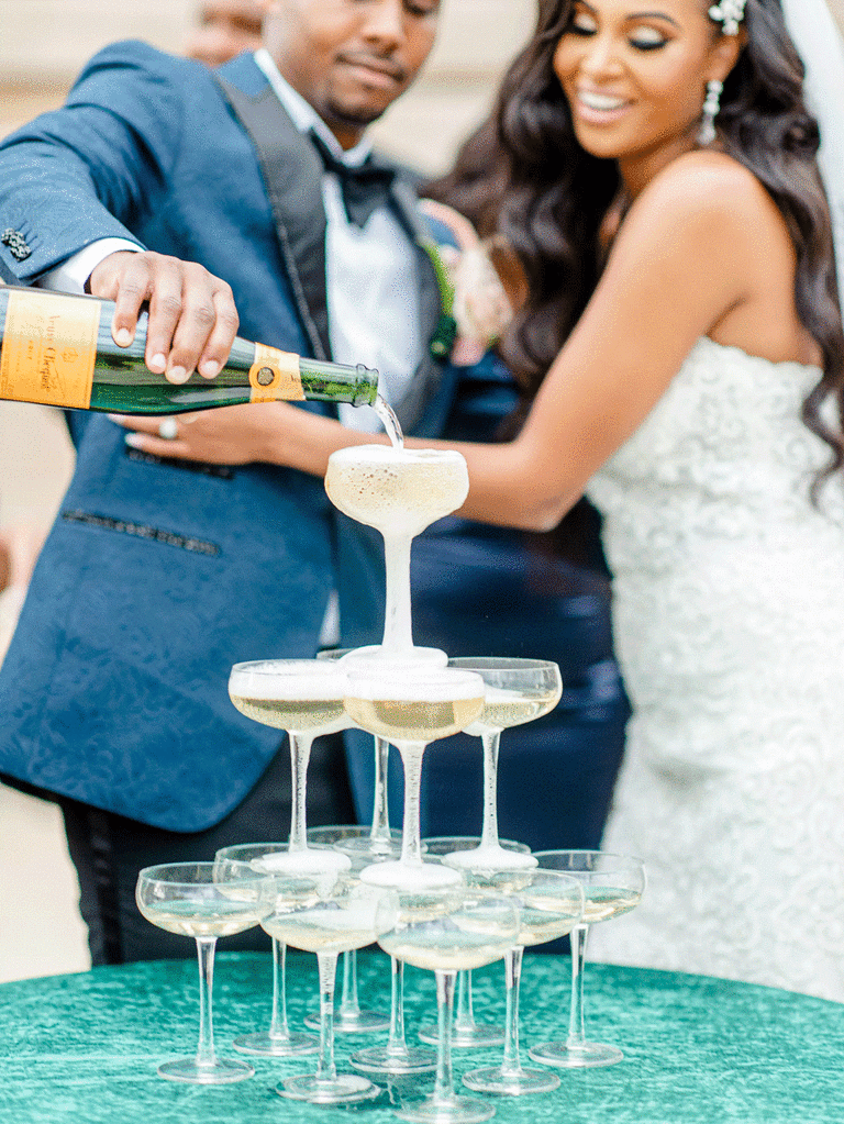 Small champagne coupe tower at wedding reception.