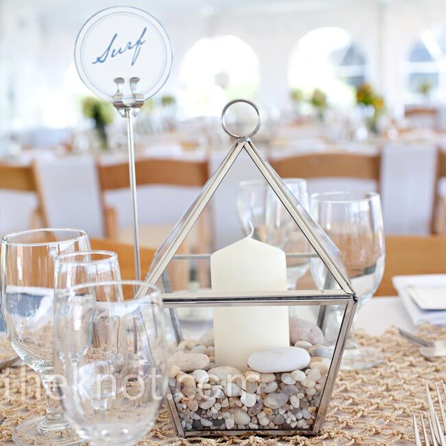 Each table held a glass lantern filled with little pebbles and a candle.