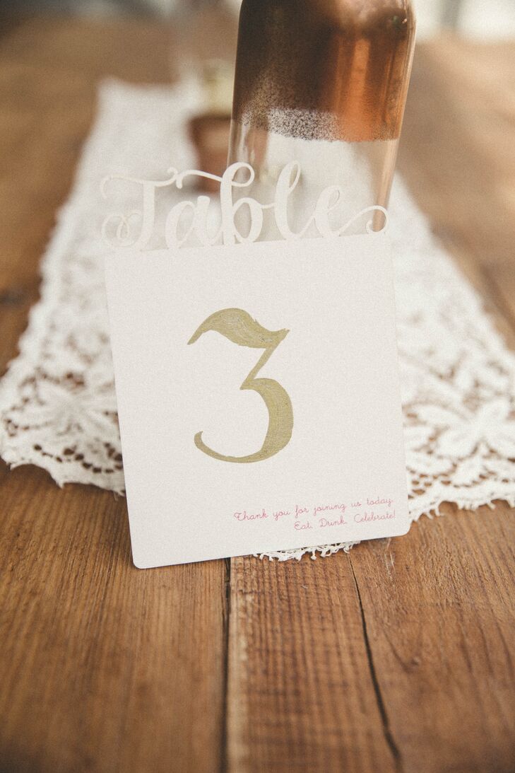 These were not the usual table numbers. Each DIY accent marked the tables with a vintage-style gold font and a sweet thank-you note in the bottom-right corner. The term “table” was also laser cut and topped the number in ivory.