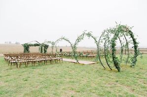 Steel Hoops Covered in Eucalyptus and Smilax Along Ceremony Aisle