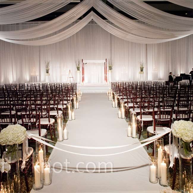 Hurricane lamps in varying heights and white draping made the ceremony space at the Hyatt at Colorado Convention Center modern and intimate. Plus, the convenient hotel rooms were a bonus for out-of-town guests.