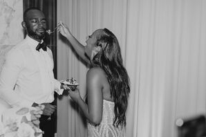 Black-and-White Photo of Bride Feeding Groom Cake During Cutting, Funny Expressions