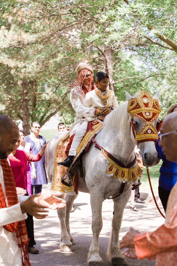Neil's father, groomsmen and junior groomsmen escorted Neil into the temple for the ceremony. The groom rode in on a white horse that was adorned in gold and red. Everything about the ceremony was thick with family and cultural traditions.