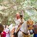 Neil's father, groomsmen and junior groomsmen escorted Neil into the temple for the ceremony. The groom rode in on a white horse that was adorned in gold and red. Everything about the ceremony was thick with family and cultural traditions.