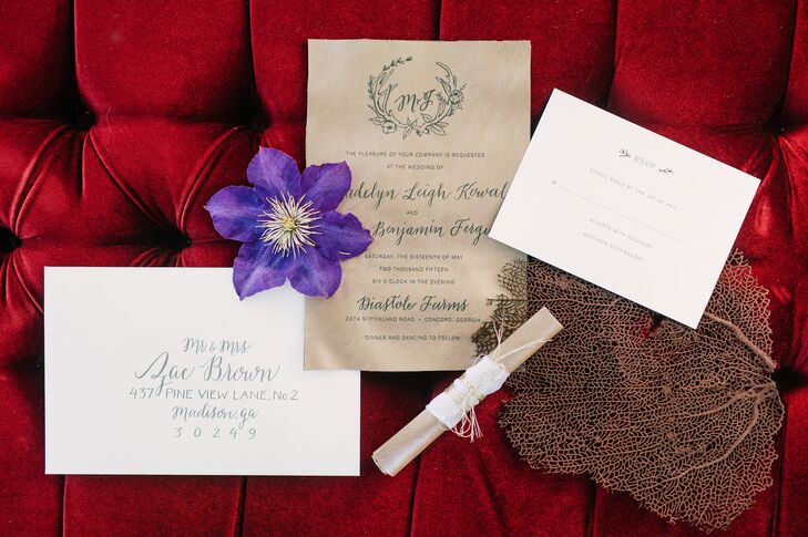 Madelyn and Joseph had custom leather invitations printed by Southern Hide. The design by Myrtle and Lloyd started with the newlyweds' custom monogram surrounded by antlers and a laurel, with whimsical calligraphy paired with modern print.