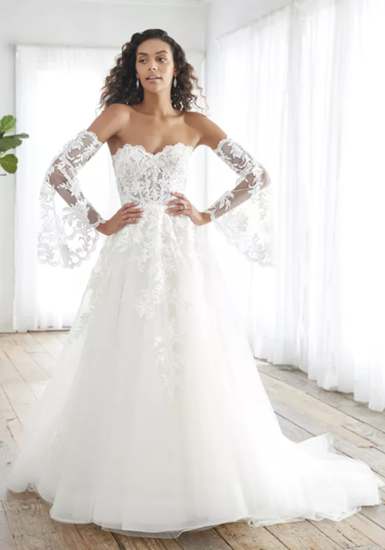 Strapless dress with A-line tulle skirt and beaded lace bodice and detachable lace illusion sleeves