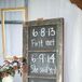 Jennifer and Jeremy married almost exactly two years from their first meeting, which they noted on a chalkboard sign displayed at their reception.