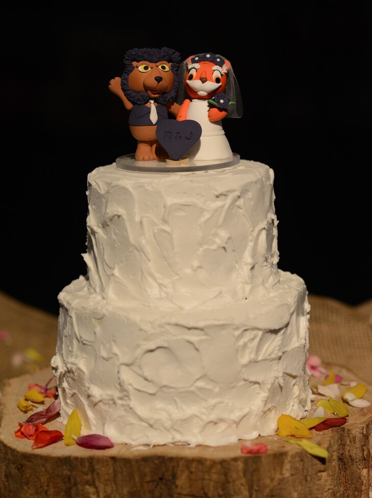 Besides their color palette, the couple gave another nod to Rebekah's alma mater, Clemson, with a custom cake topper that featured a tiger bride.