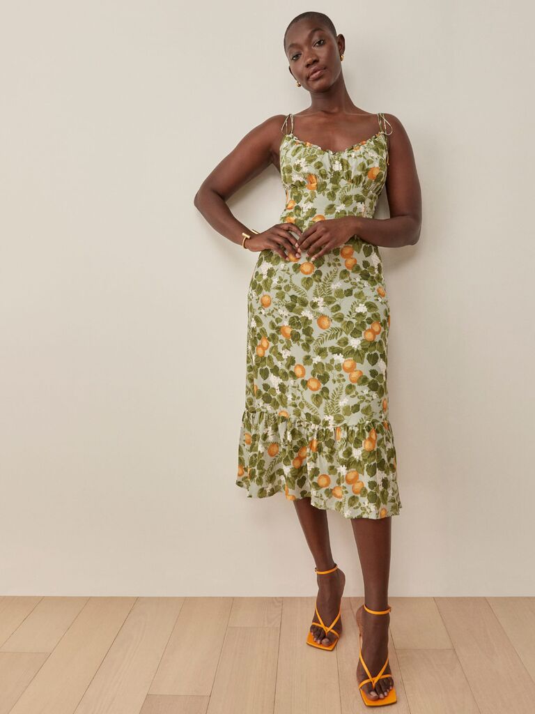 Reformation summer floral dress for weddings with orange motifs