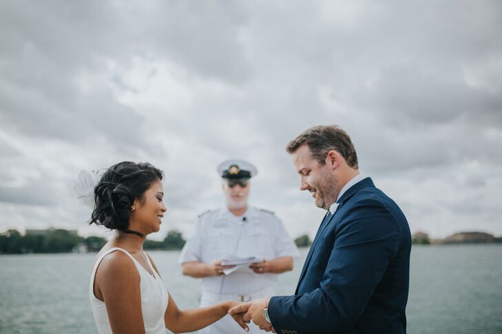 Josephine and Justin had to get special permission from the yacht club to get married on the main dock, where the yachts are parked. Their wedding officiant was a former commodore who donned his navy whites for the occasion.