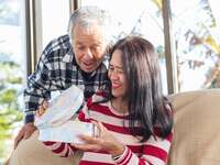 A couple exchanging gifts together 