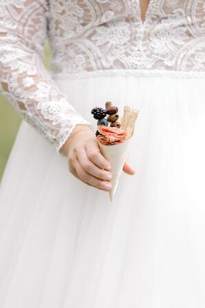 Bride Holding Charcuterie Cup During Wedding at Cypress House in New Columbia, Pennsylvania