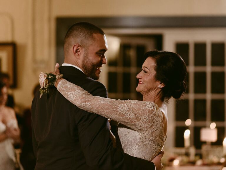 Groom dancing with mother during wedding reception
