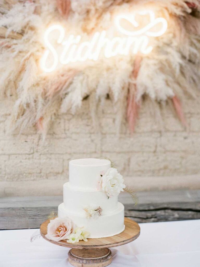 Small white wedding cake with flowers