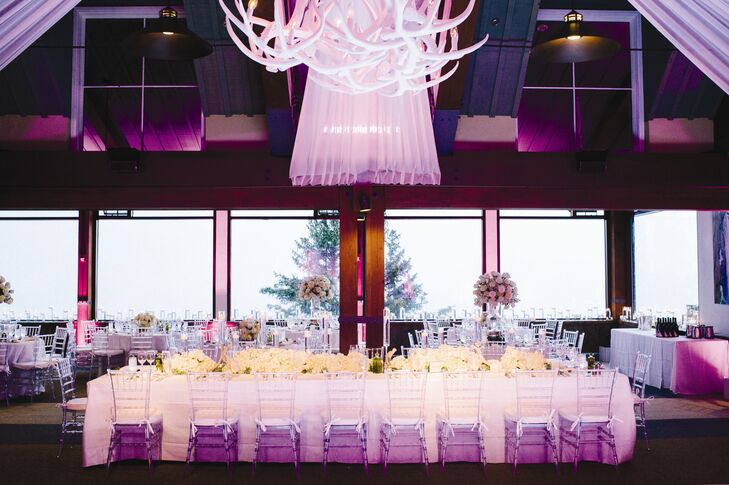 The all-white decor was complemented with soft pink uplighting.