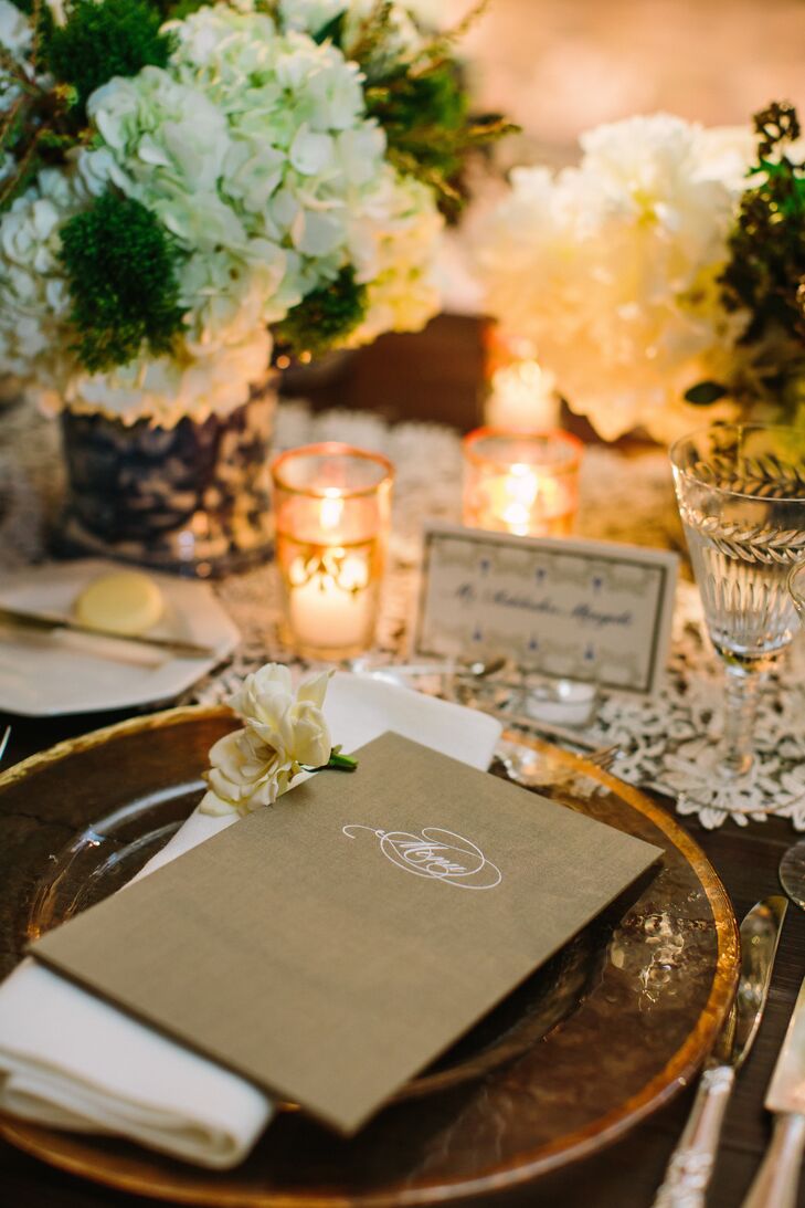 Places were set with the a sophisticated menu for the seated dinner with the card itself held in a taupe rectangular card also made of heavy card stock that retained the white menu by the corners with fabric that folded over. When you flipped the card over, embossed in silver with a decorative type read ‘Menu’ and I took a bunch of extra menus home with me so in the future if I want to recreate the menu and have a dinner party, I'll have the menu from my wedding day to display! says Leslie.