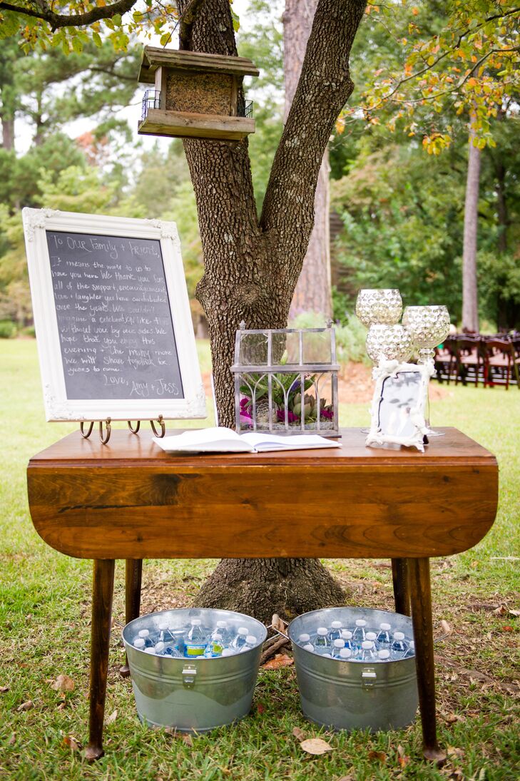 The couple used both rustic and elegant design elements, including birdhouses, chalkboards and silver chalice-inspired candle holders.
