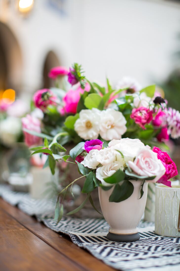 Tables were topped with arrangements of peonies, roses, dahlias and ranunculus in shades of pink.