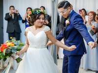 Bride and groom entrance at barn wedding reception