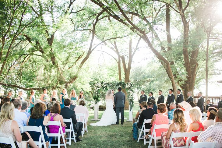 During their ceremony, Michelle and Derik incorporated a unity-candle ritual. A rustic table held three candlesticks: one for Michelle’s grandmother, one for Derik’s grandmother and one for Michelle and Derik. “I really loved the symbolism and that all the candlesticks came from our families,” Michelle says. “It was such a special moment to symbolize the unity of two families merging.”