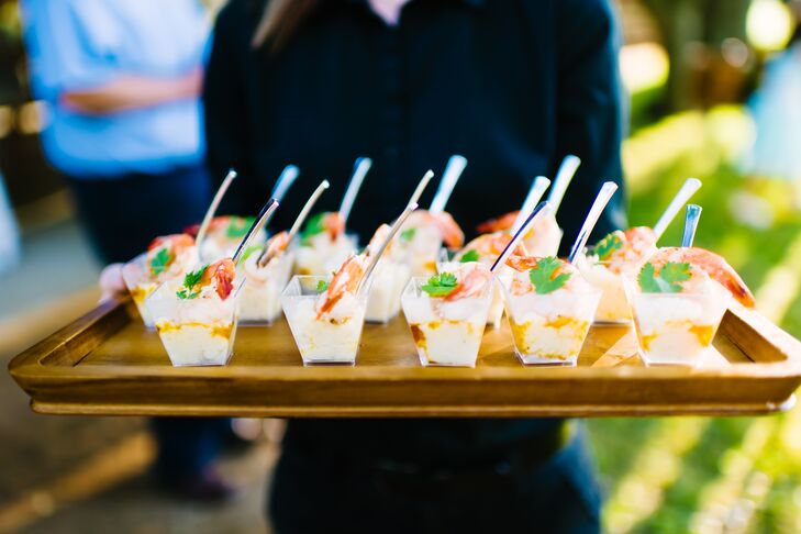 After the ceremony, guests moved to the Pecan Springs Ranch covered pavilion in Austin, Texas, to enjoy bluegrass music and passed appetizers. Mini shrimp and grits were a delicious Southern touch.
