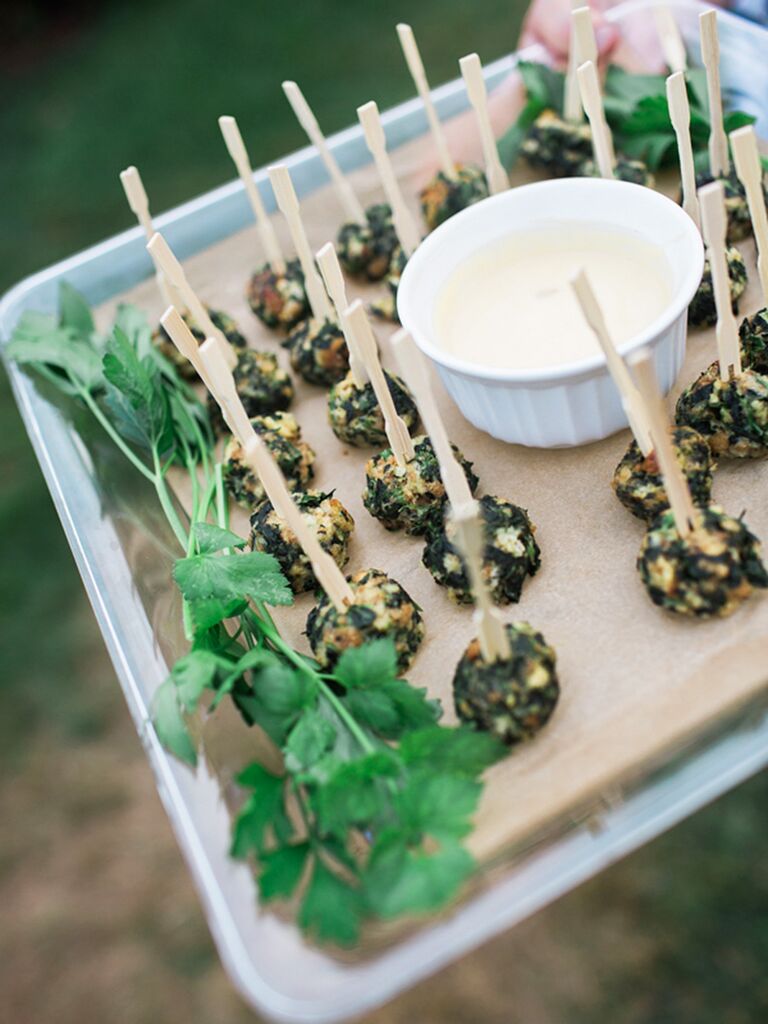 Spinach balls with white dipping sauce wedding reception appetizer