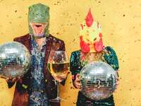 Funny Anniversary Image of couple dressed as T-Rex and Chicken