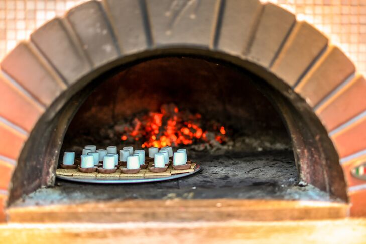 “We chose Fire & Company catering because we felt their approach to catering lent itself to the uniqueness of our party,” Christine says. They cooked the entire dinner at the farm and topped it off with s'mores, hot from a wood-fired oven. "Having the vintage trucks and the food being smoked and cooked on-site was a thrill to see," Christine says.