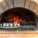 “We chose Fire & Company catering because we felt their approach to catering lent itself to the uniqueness of our party,” Christine says. They cooked the entire dinner at the farm and topped it off with s'mores, hot from a wood-fired oven. "Having the vintage trucks and the food being smoked and cooked on-site was a thrill to see," Christine says.