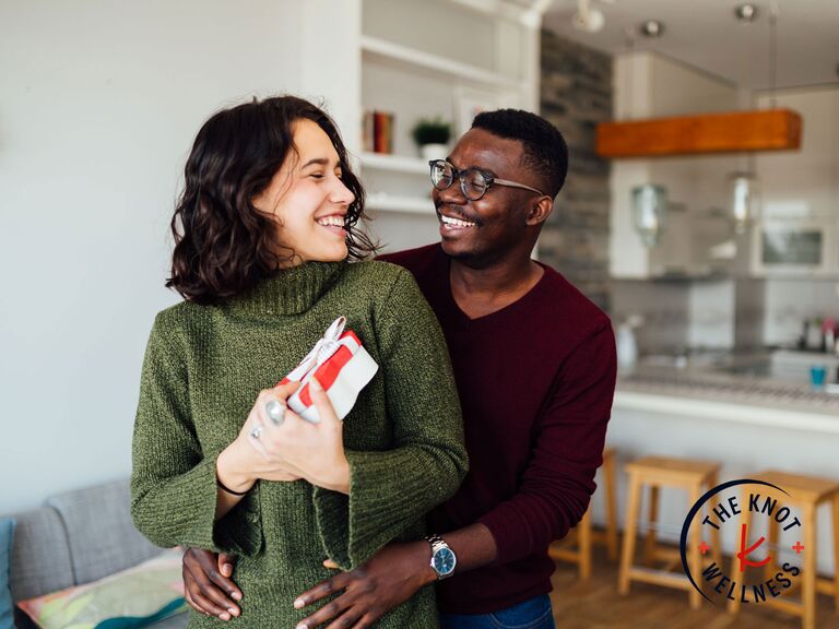 Man presenting gift to his partner