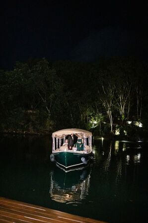Couple Entering Wedding Reception by Boat