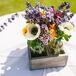Lush flower arrangements of ivory anemones and lavender were arranged inside a rustic wood box and served as a table centerpiece.