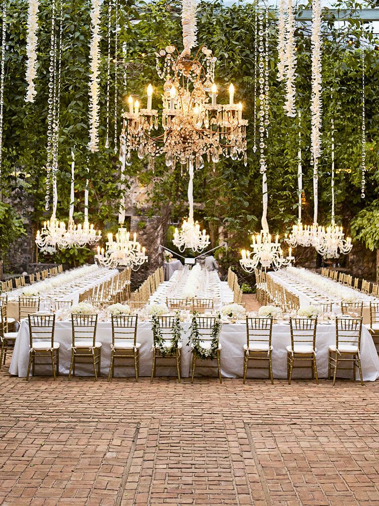 Outdoor wedding reception with chandeliers