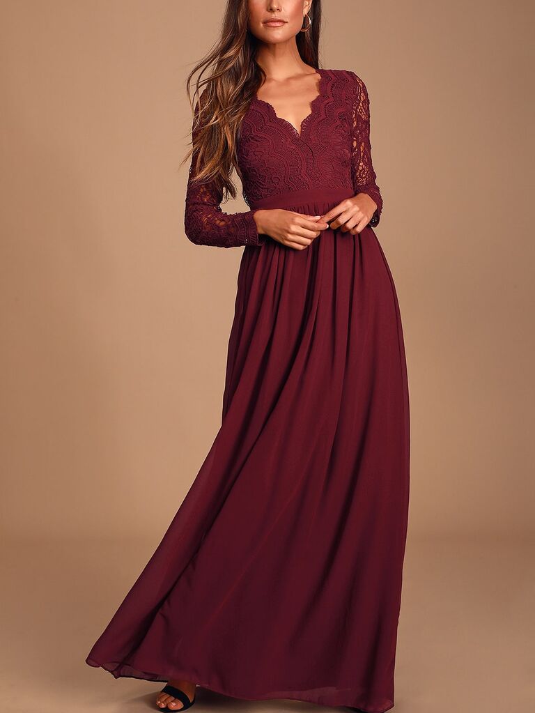 Model wearing burgundy dress with long-sleeves and lace details