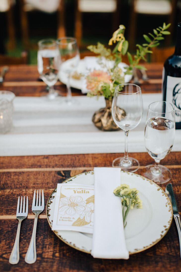 Rustic Place Setting with White Chargers and Wildflowers