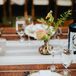 Rustic Place Setting with White Chargers and Wildflowers