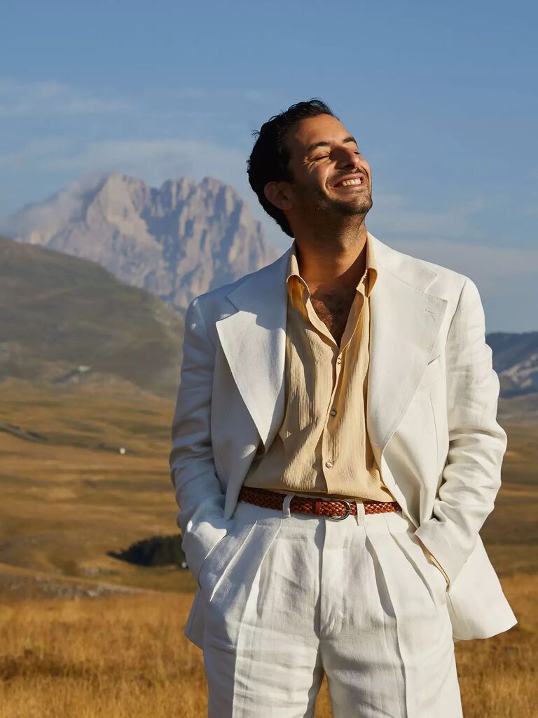 Modern white suit for a wedding by Giuliva Heritage. 