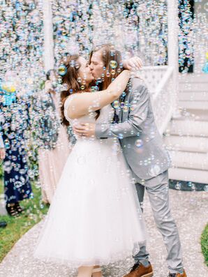 Couple Kisses During Bubble Grand Exit